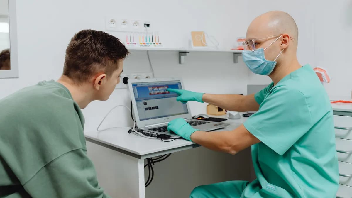 Translator accompanying a consultation between dentist and patient