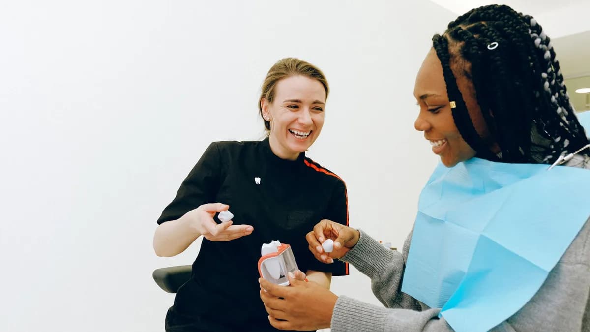 Dentist consulting a patient about smile makeover pricing